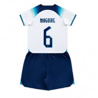 Otroški Nogometni dresi Anglija Harry Maguire #6 Domači SP 2022 Kratek Rokav (+ Kratke hlače)